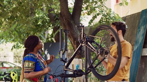 Side view of man with bicycle