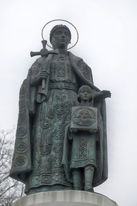 Low angle view of statue against sky