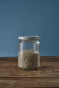 Close-up of glass of jar on table