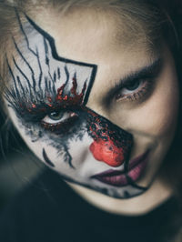 Close-up portrait of young woman with eyes closed