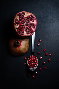 High angle view of fruits against black background