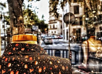 Close-up of illuminated lighting equipment on street in city