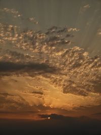 Low angle view of dramatic sky during sunset