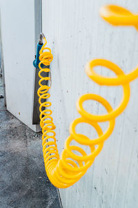 High angle view of yellow spiral of a water pump at a self service car wash 