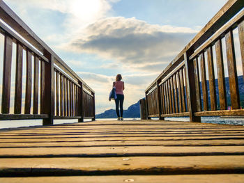 Man standing on road against sky