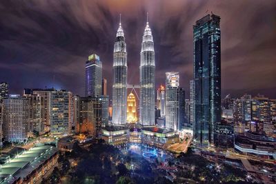 Aerial view of city lit up at night