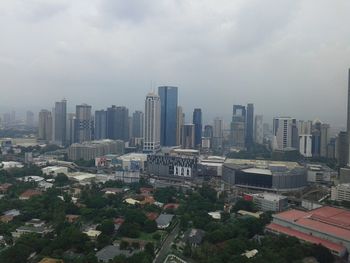 High angle view of buildings in city against sky