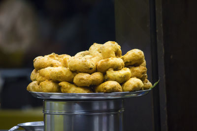 Close-up of medu vada in plate at food stall