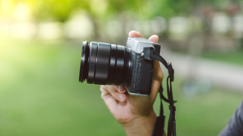 Close-up of hand holding camera