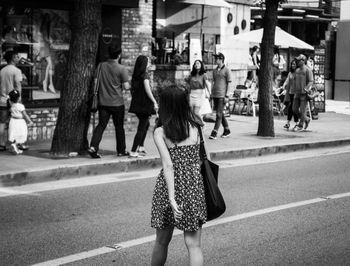 Woman standing in city