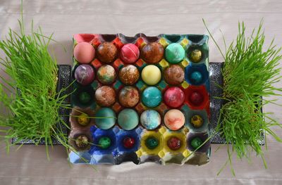 High angle view of easter eggs in carton