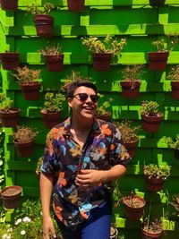 Young man wearing sunglasses standing outdoors