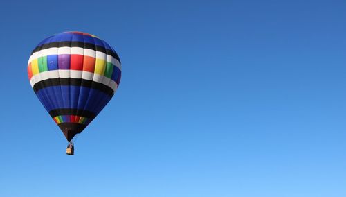 Hot air balloon against clear blue sky