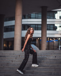 Portrait of a young woman standing outdoors