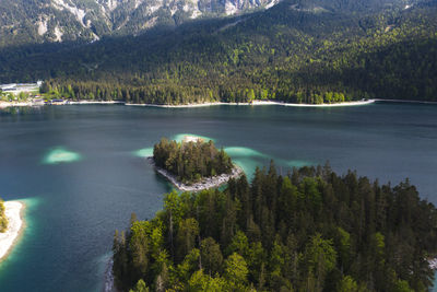 High angle view of river amidst trees against sky