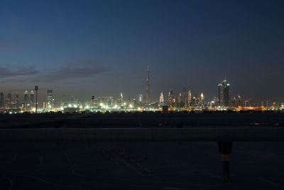 Illuminated city buildings at night