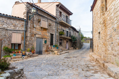 Low angle view of old buildings against sky