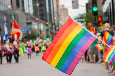 Multi colored flags on street in city