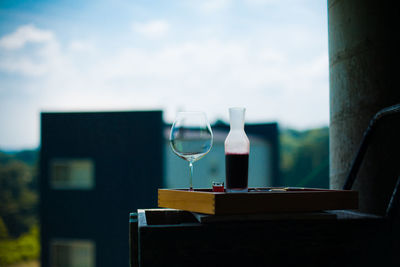 Wineglass and drink on serving tray