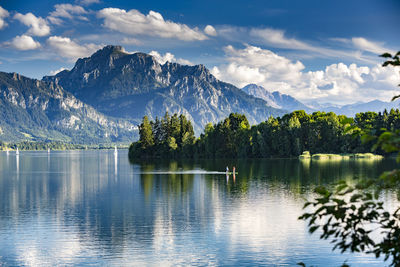 Scenic view of lake and mountains against sky