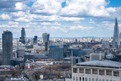 High angle view of buildings in city against sky