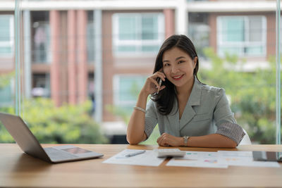 Businesswoman working at desk in office