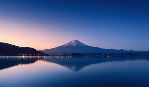 Scenic view of mountains against clear blue sky