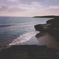 Scenic view of sea against sky at sunset