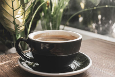 Close-up of coffee cup on table