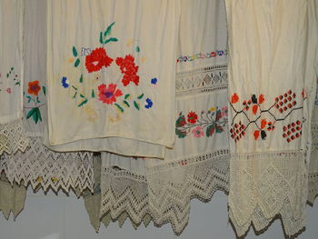 Close-up of white curtain hanging at home