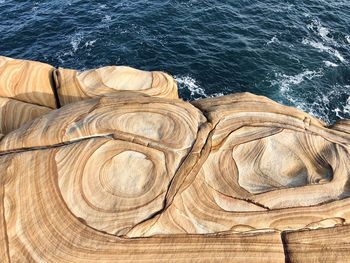 High angle view of rock formation in sea