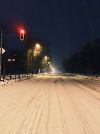 Light trails on street at night during winter