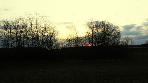 Scenic view of landscape against sky at sunset