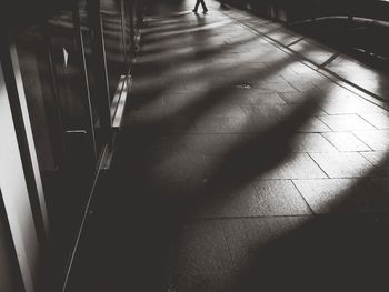 Full length of woman standing on tiled floor