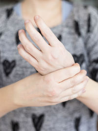 Close-up of couple holding hands