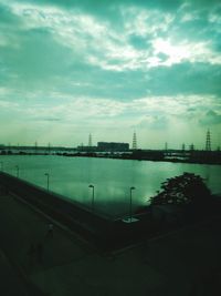 Harbor against cloudy sky