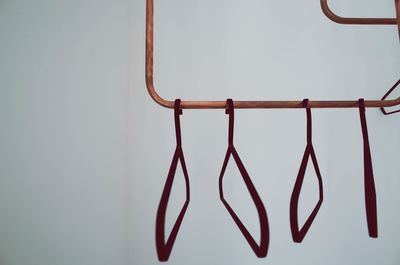 Close-up of red hanging on metal