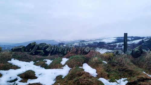 Scenic view of mountains against sky during winter