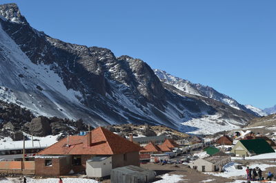 Scenic view of snowcapped mountains against clear sky