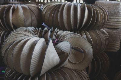 Close-up of asian style conical hats for sale in store