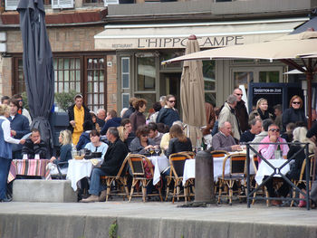 Group of people in front of building in city