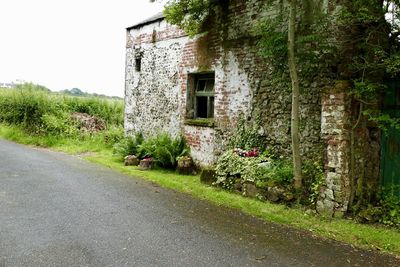 View of old building by road