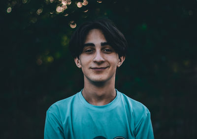 Portrait of young man standing outdoors