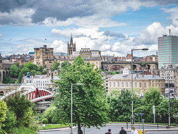 High angle view of trees and buildings in town