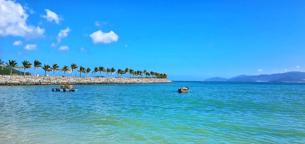 Scenic view of sea against blue sky