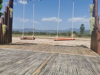 View of empty swing against sky