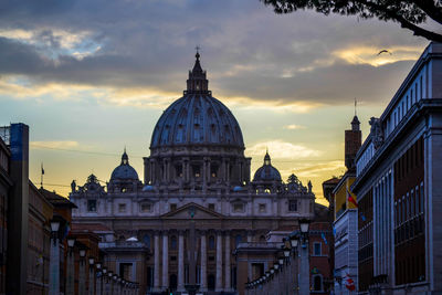 View of st. peter's basilica
 in roma against sky during sunset