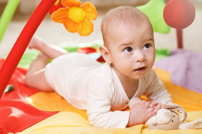 Portrait of cute baby boy sleeping on bed at home