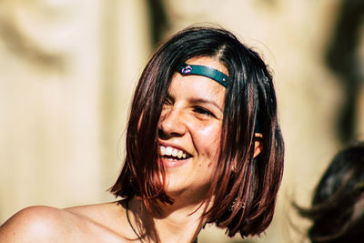 Close-up portrait of a smiling young woman