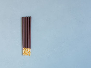 Directly above shot of electric lamp on table against white background